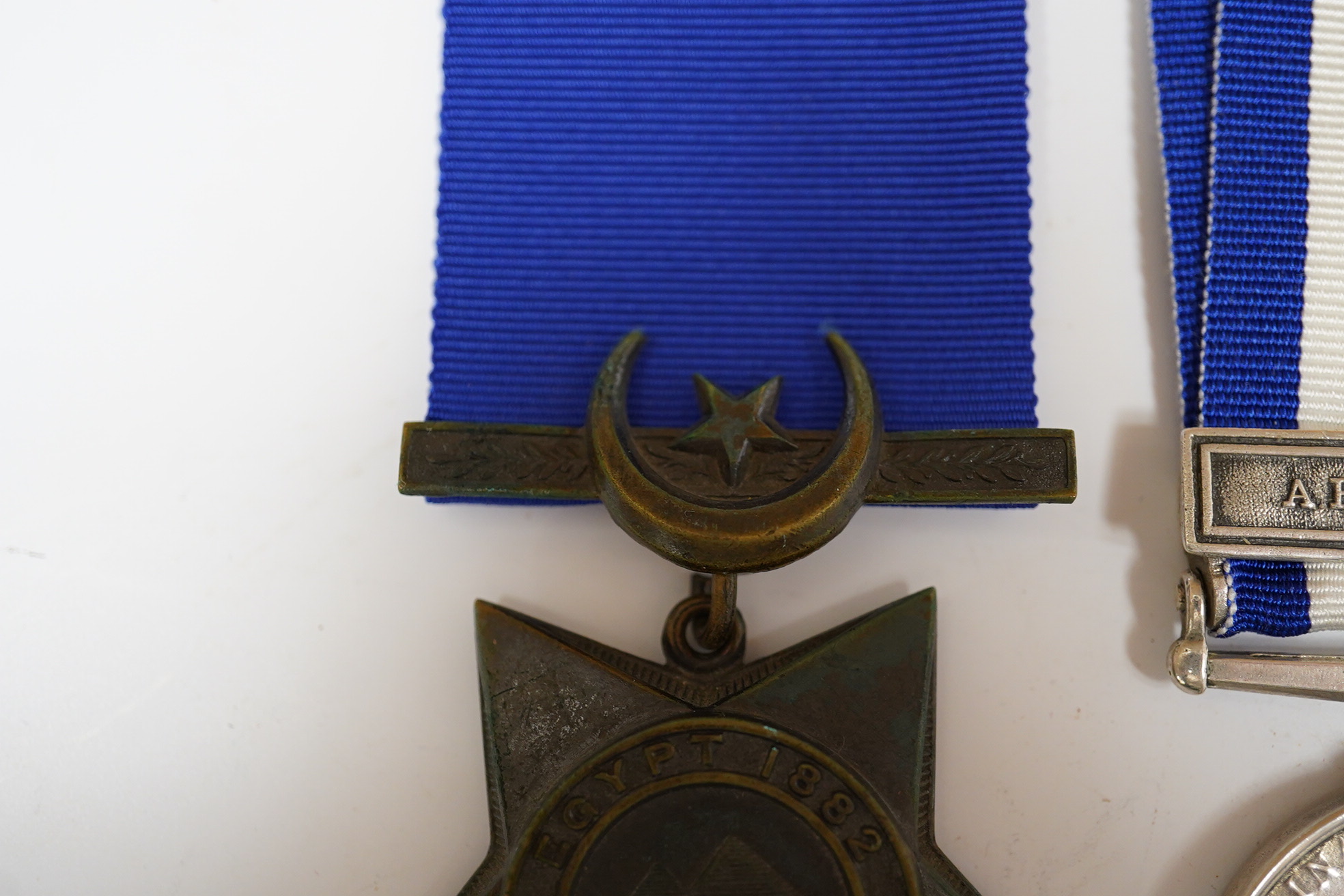 An Egypt Medal 1882-89 with Abu Klea clasp to Corpl H.Bennett 4th Coy. 2nd Batt. Gren. Gds. and a replica Khedive's Star 1882.